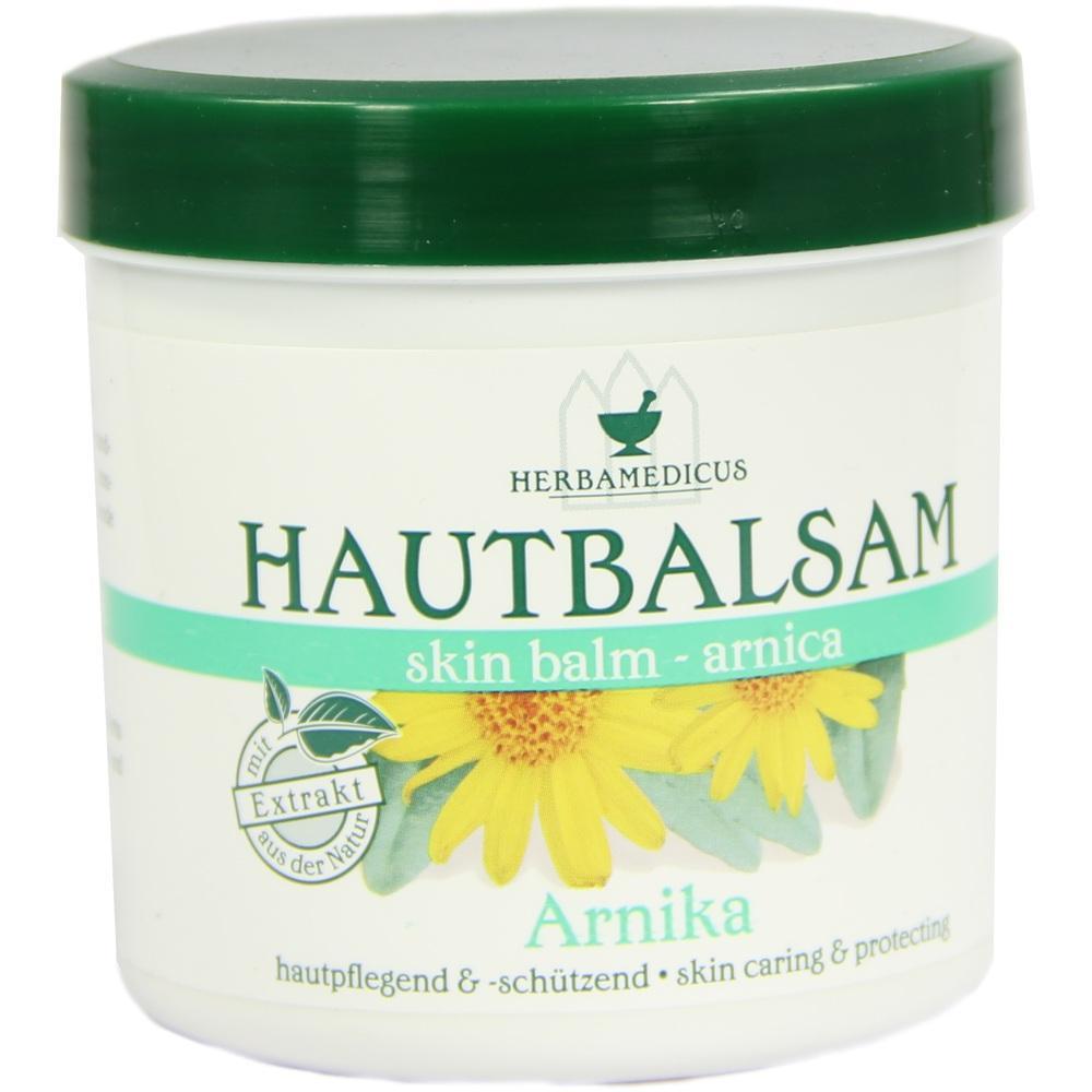 Weiße Dose mit grünem Deckel und der Aufschrift "Hautbalsam Arnika".