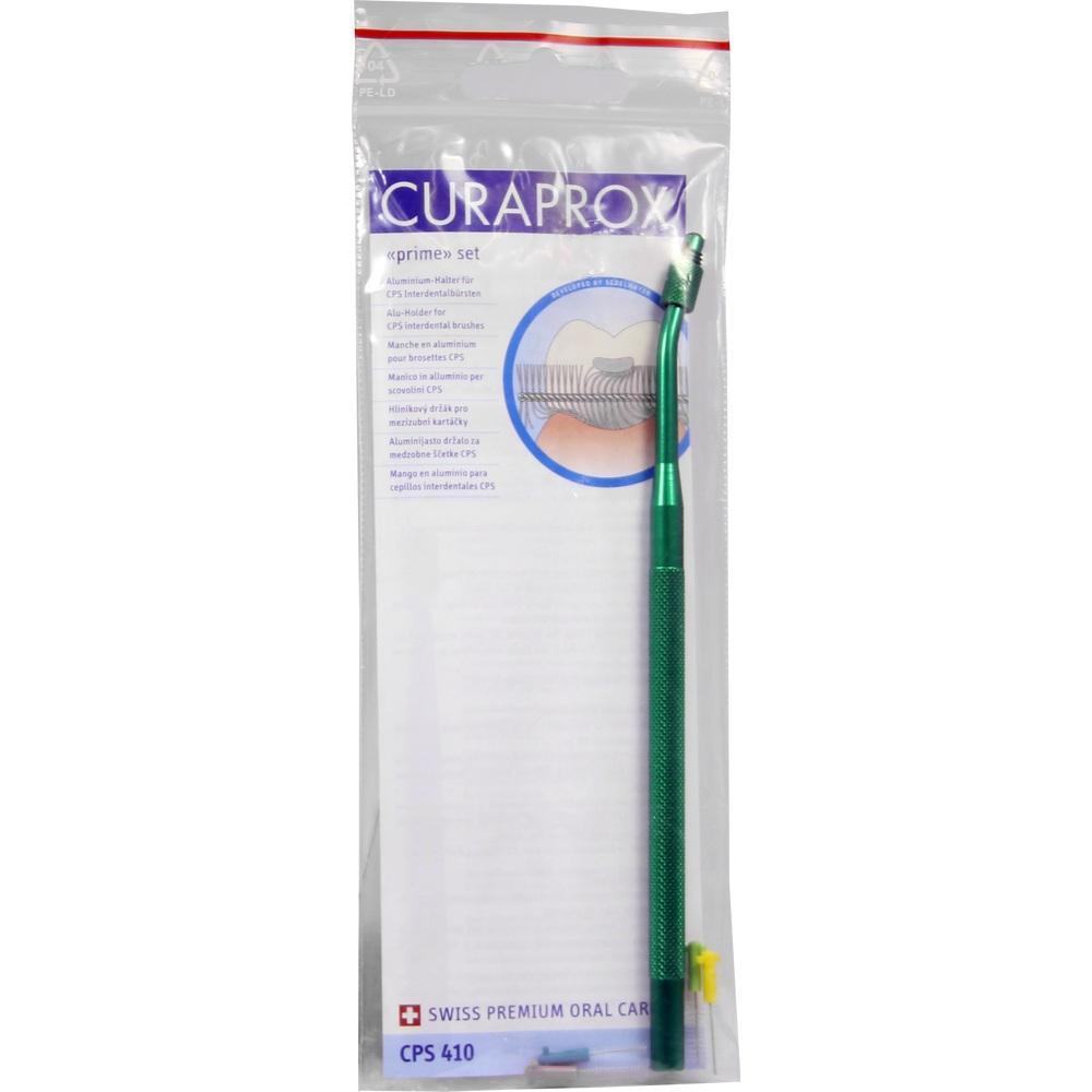 Grüner Interdentalbürstenhalter in einer Plastikverpackung mit blauer Aufschrift.
