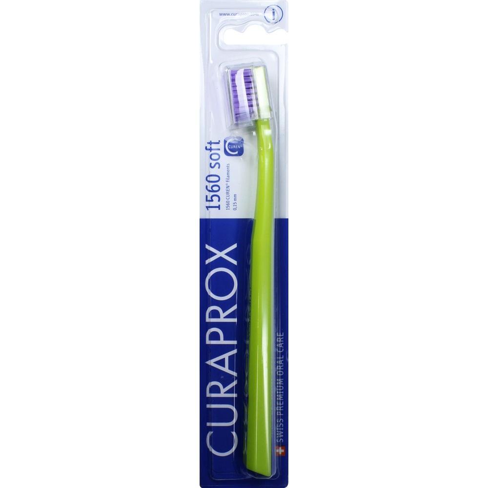 Eine grüne Zahnbürste in einer blauen Verpackung.