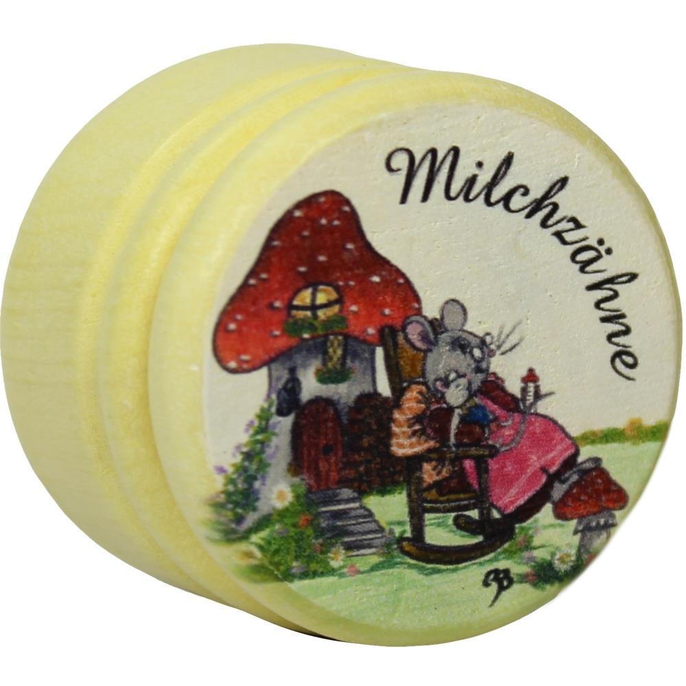 Eine kleine Dose mit einer Maus vor einem Pilzhaus, beschriftet mit "Milchzähne".