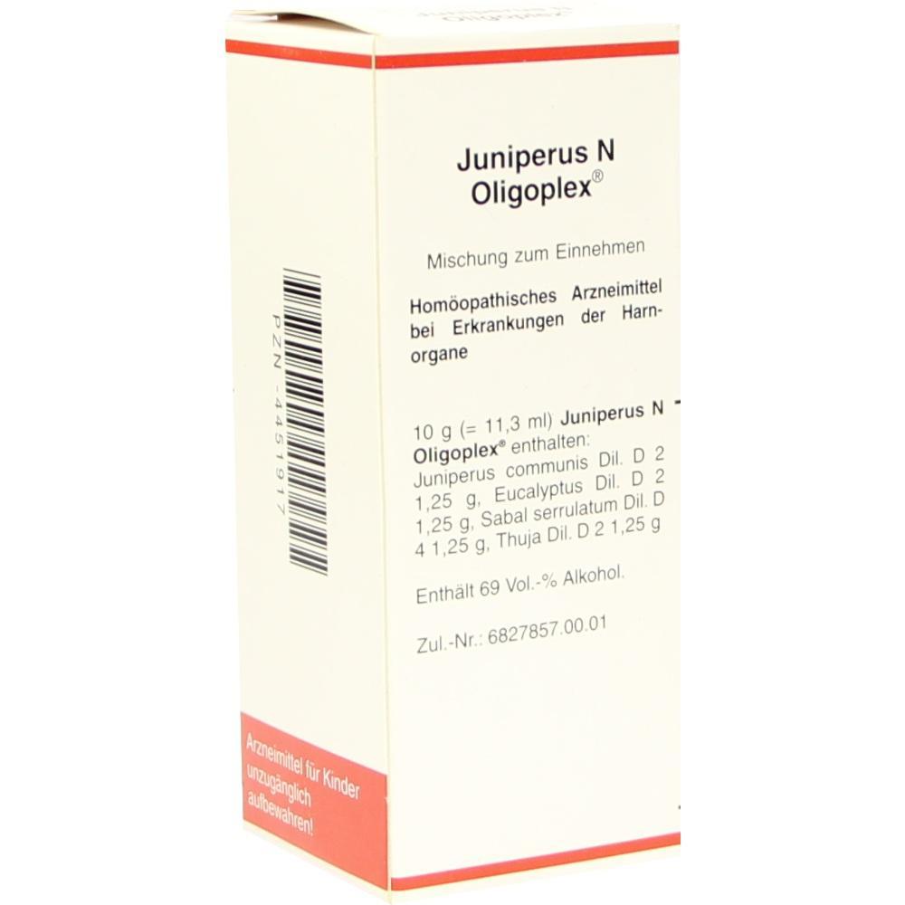 Weiße Verpackung von homöopathischem Medikament namens Juniperus N Oligoplex.