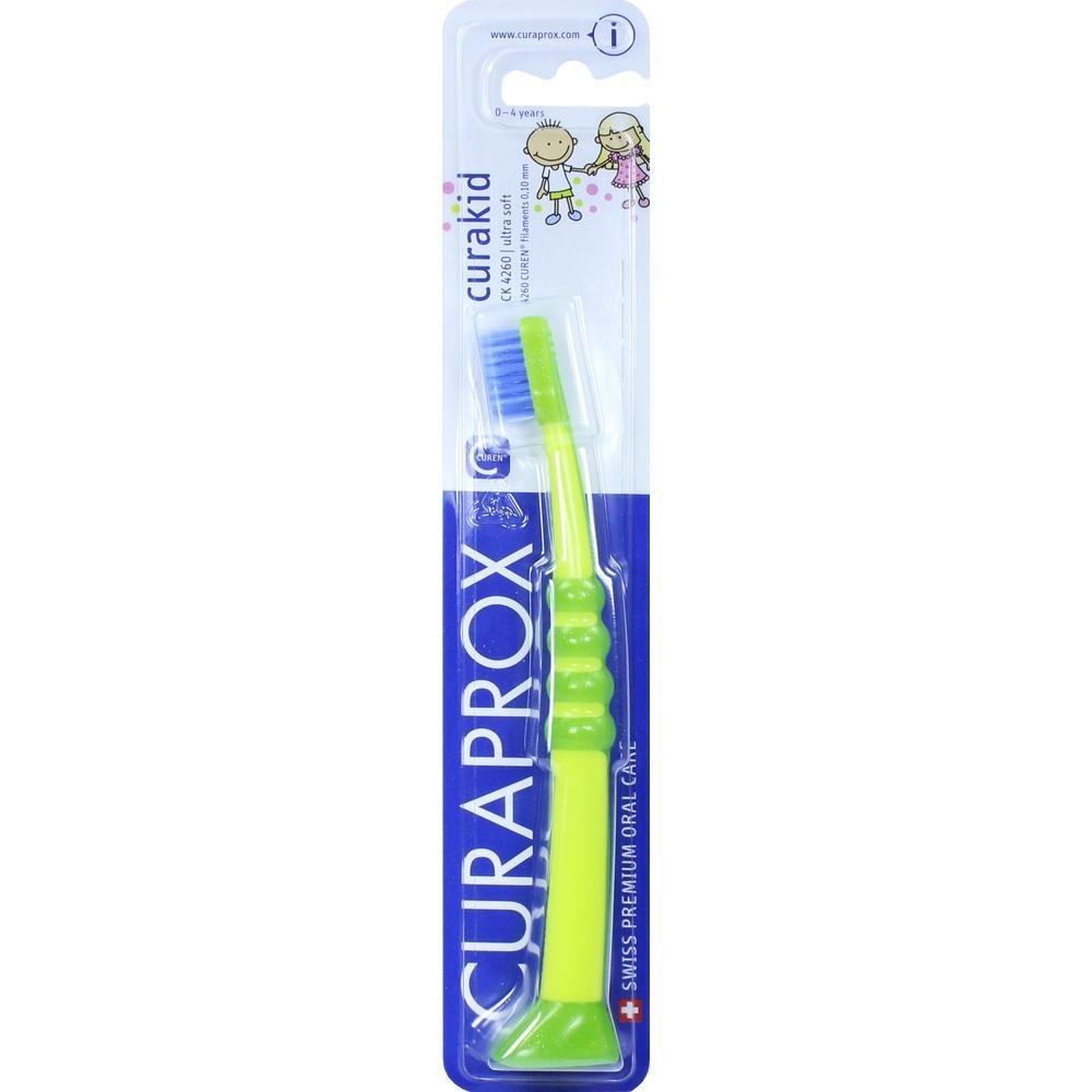 Gr&uuml;ne Kinderzahnb&uuml;rste in einer blauen Verpackung von Curaprox.