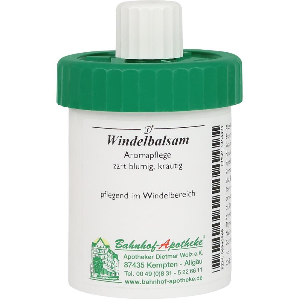Eine weiße Dose mit grünem Deckel für Windelbalsam.
