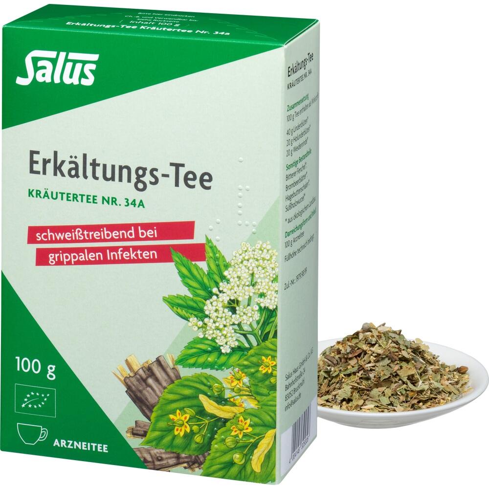Eine grüne Packung Erkältungs-Tee steht neben einem Teller mit Teeblättern.