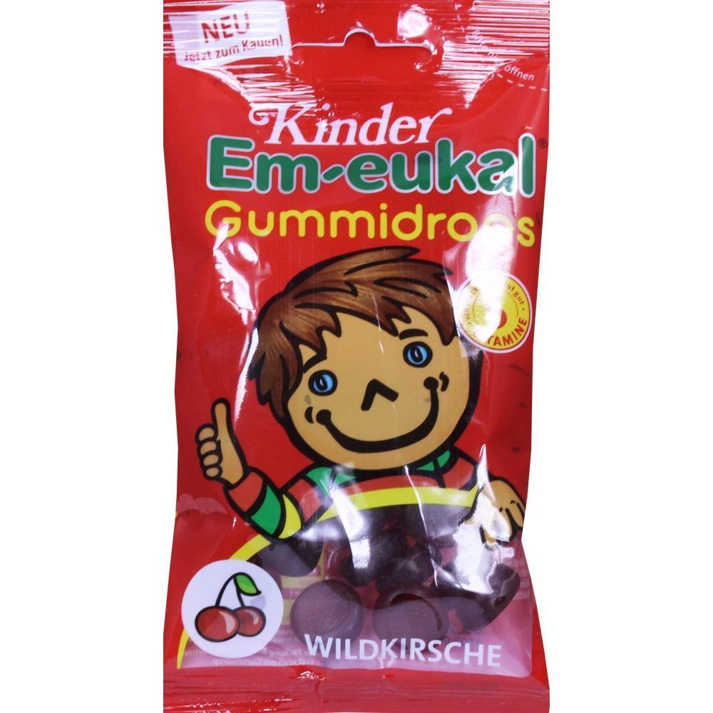Eine rote Packung Kinder Em-eukal Gummidrops mit Wildkirschgeschmack und einem lächelnden Kind.
