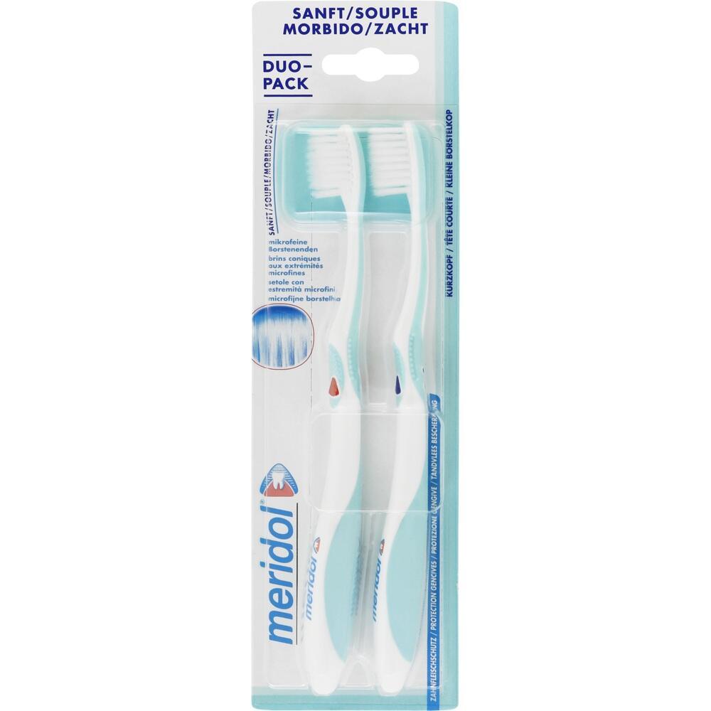 Zwei wei&szlig;e Zahnb&uuml;rsten in einer transparenten Verpackung von Meridol.