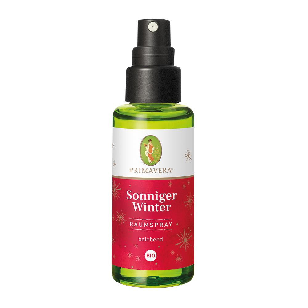 Gr&uuml;ne Flasche mit rotem Etikett, darauf steht "Sonniger Winter Raumspray".