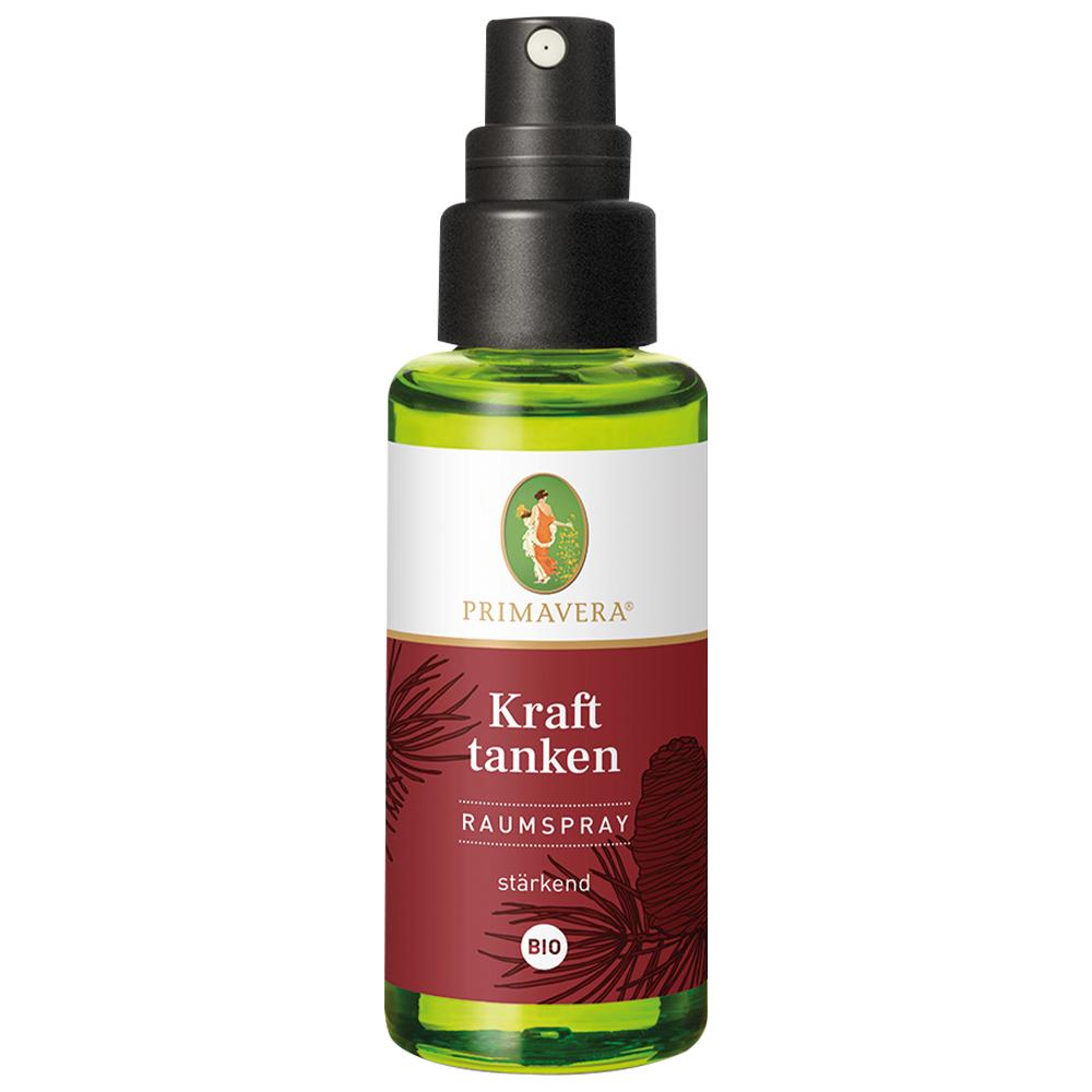 Gr&uuml;ne Spr&uuml;hflasche mit rotem Etikett, das "Kraft tanken" sagt.