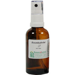 Braune Sprühflasche mit weißem Deckel und Etikett auf der Vorderseite.
