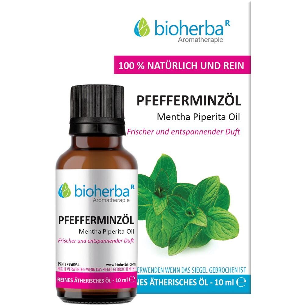 Flasche Pfefferminzöl vor einer Verpackung mit Minzblättern.