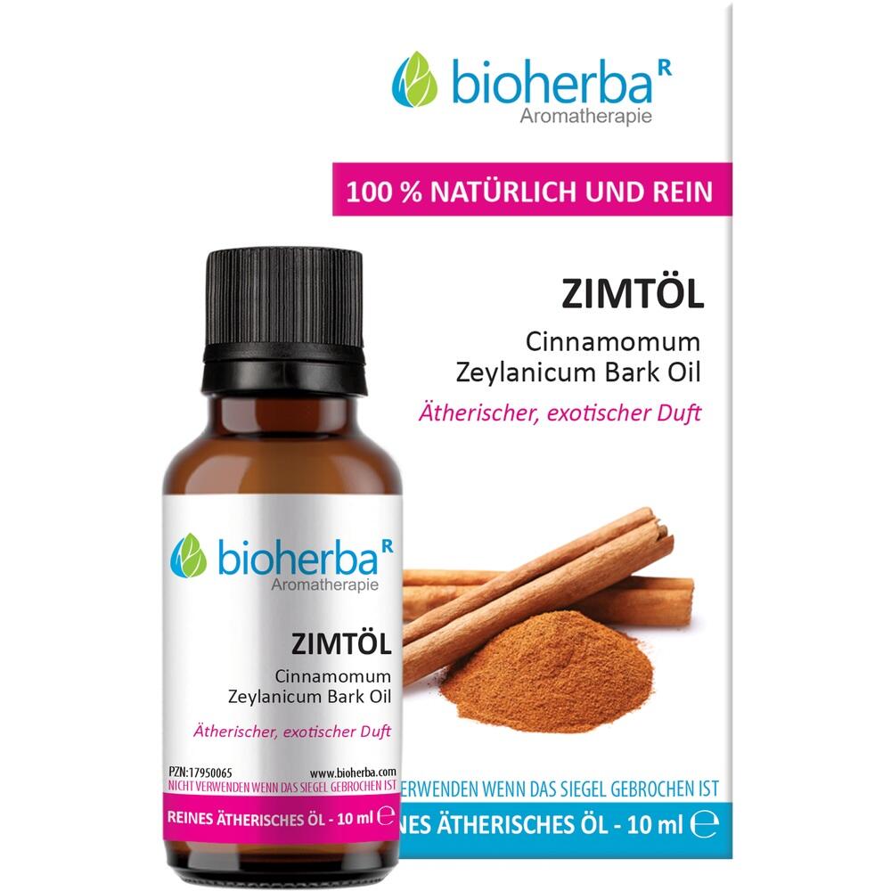 Braunes Fläschchen Zimtöl neben Zimtstangen und Zimtpulver.