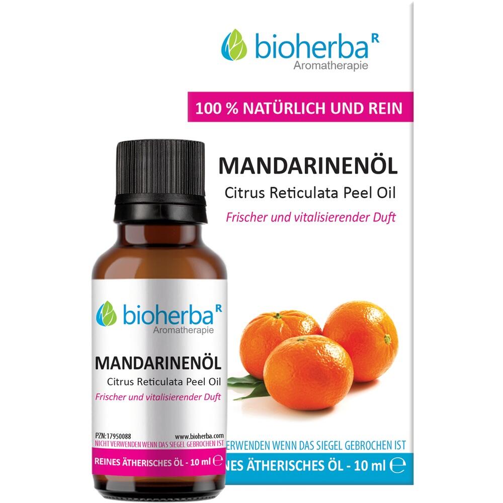 Eine Flasche Mandarinenöl vor einem Flyer mit Mandarinenbild.