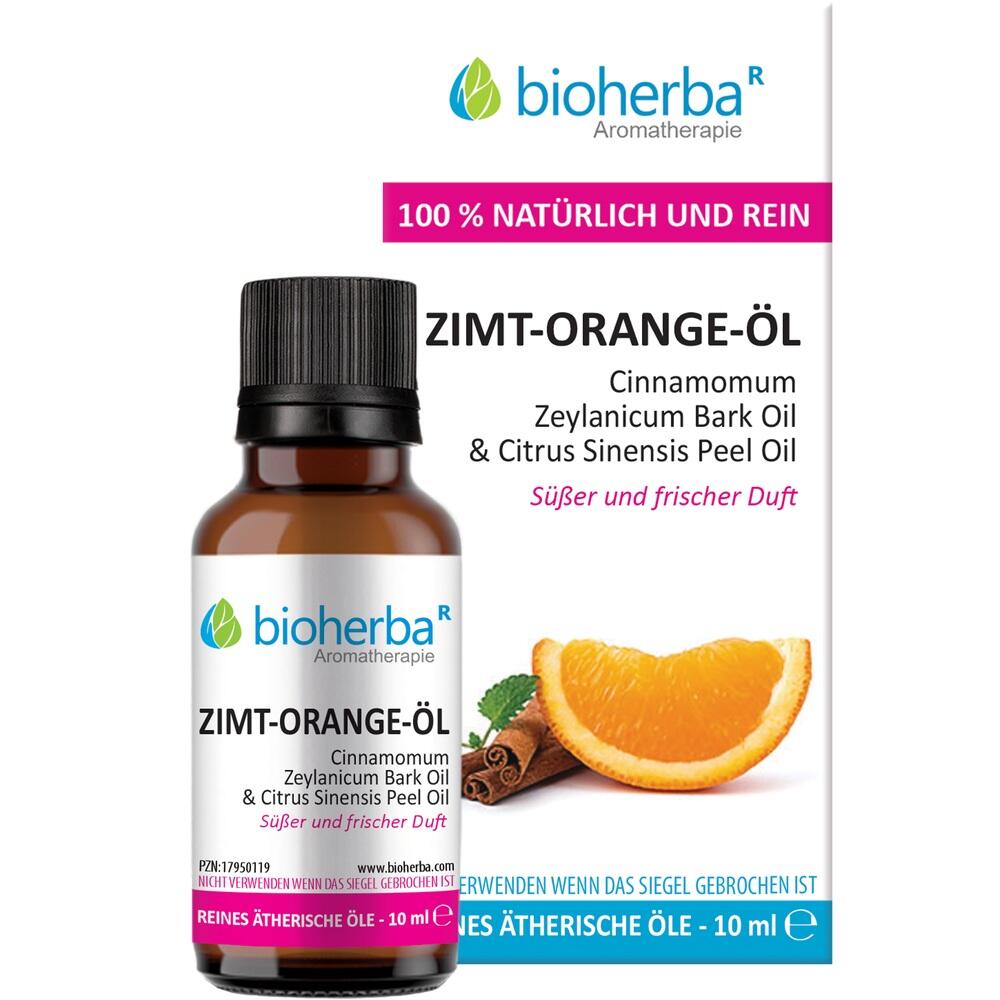 Eine Flasche Zimt-Orange-Öl mit einer Orange und Zimtstangen.