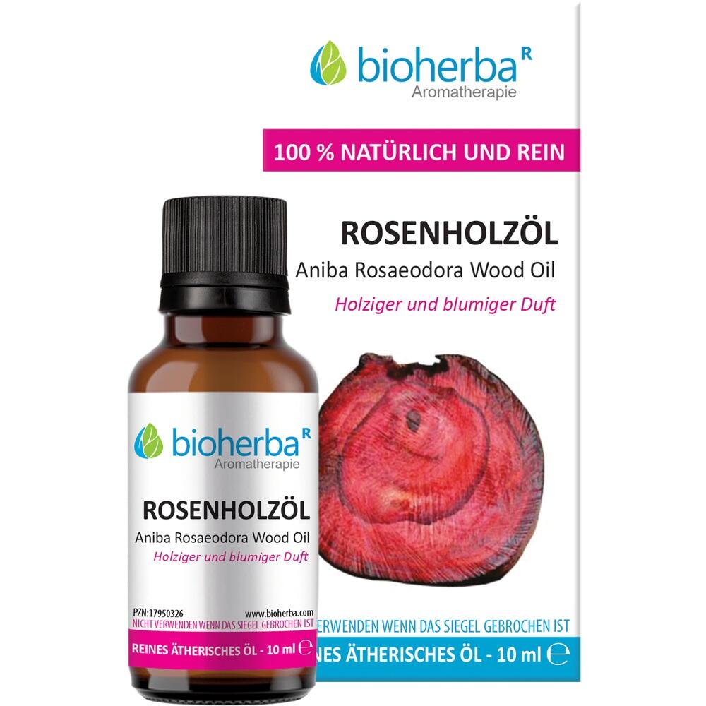 Flasche Rosenholzöl mit Produktverpackung im Hintergrund.