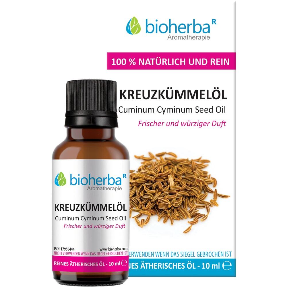 Flasche mit Kreuzkümmelöl und Kreuzkümmelsamen auf der Verpackung.