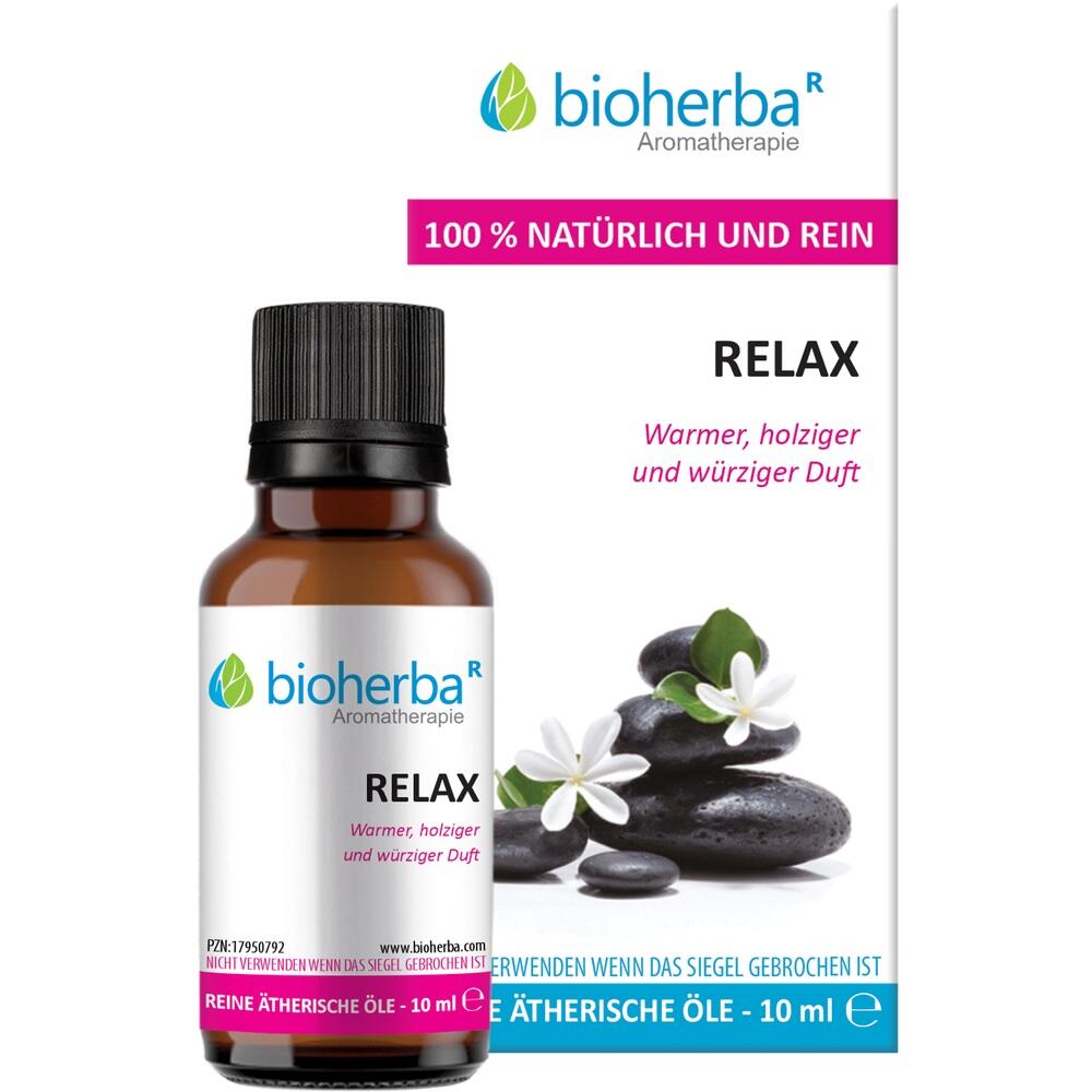 Flasche mit ätherischem Öl namens "Relax" neben einer Verpackung mit Steinen und Blume.
