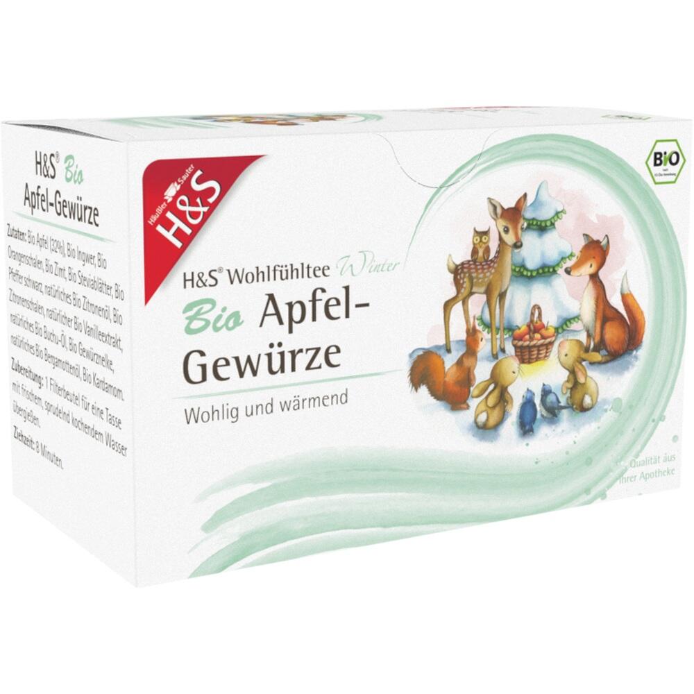 Die Teepackung zeigt Waldtiere um einen Weihnachtstisch auf grünem Hintergrund.