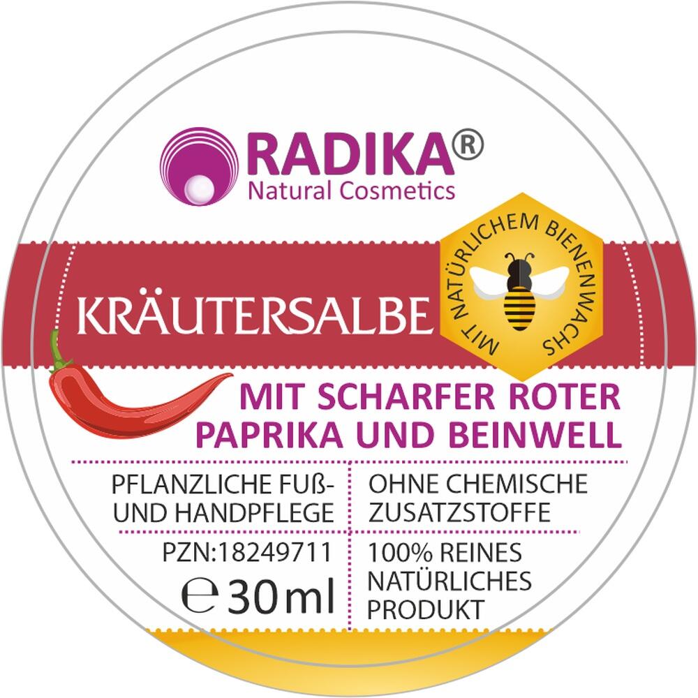 Auf einer Dose steht "Kräutersalbe mit roter Paprika und Beinwell".